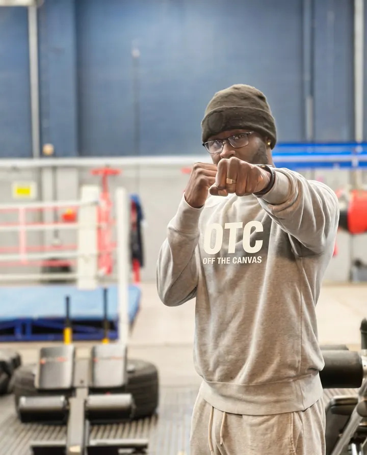 Luis Palmer, founder of Off The Canvas Boxing CIC, in a boxing stance at the gym
